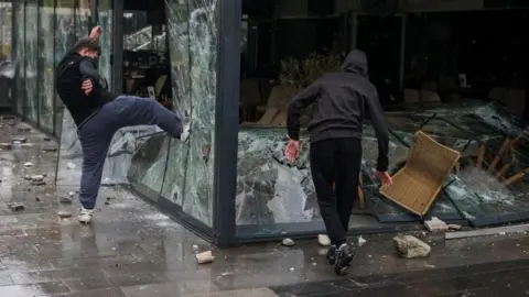 Reuters Youths smash windows and wreck a bar in Kocani